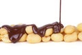 Melted Chocolate Pouring Over Peanuts Royalty Free Stock Photo