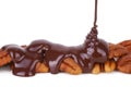Melted Chocolate Pouring Over Pecans Royalty Free Stock Photo