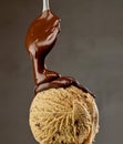 melted chocolate sauce flowing on ice cream Royalty Free Stock Photo