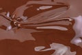 Melted chocolate swirl background. Liquid chocolate close-up Royalty Free Stock Photo