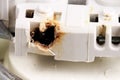 melted electrical outlet contacts close-up Royalty Free Stock Photo