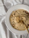 Melted ice cream hazelnut caramel bowl Royalty Free Stock Photo