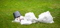 A melted snow man with a sad face as symbol of the end of the winter