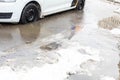 Melted snow after snowfall in Moscow. Deep puddles from the snowdrift.