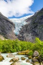 Briksdalsbreen glacier with melting blue ice