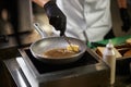 Melting butter for frying in pan.