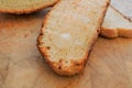 Melting butter on a slice of rustic toasted bread Royalty Free Stock Photo