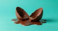 Melting Chocolate Easter Egg on Teal Background Royalty Free Stock Photo