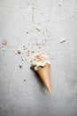 Melting coconut ice cream scoops and waffle cone. top view Royalty Free Stock Photo