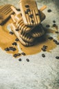 Melting coffee latte popsicles with roasted coffee beans, marble background