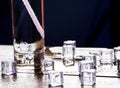 Melting cubes of transparent cold ice and a glass of soda with cocktail straw