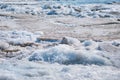 Melting of dirty ice floes during ice drift Royalty Free Stock Photo