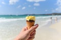Melting ice cream on beach in summer hot weather ocean landscape nature outdoor vacation , Yellow ice cream mango with nuts / Ice Royalty Free Stock Photo
