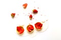 Melting ice cream in waffle tartlets with strawberries on white background. National ice cream day 19 july concept. Creative copy Royalty Free Stock Photo