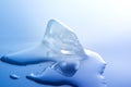 Melting ice cube. Close-up. Macro. White blue tone. Royalty Free Stock Photo