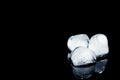 Melting ice cubes on black background. Royalty Free Stock Photo