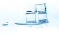 Melting ice cubes with reflection isolated on white. Royalty Free Stock Photo