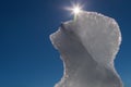 Melting ice floe with sun and blue sky