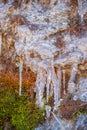 Melting Ice on the Mossy Rock Surface