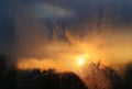 Melting ice, water drops and sunlight in a winter morning on glass Royalty Free Stock Photo