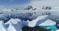 Melting icebergs on water of Southern Ocean to ice-shelves, glaciers, mountains of Antarctica aerial Royalty Free Stock Photo