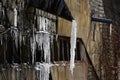 Melting icicles on a brick wall Royalty Free Stock Photo