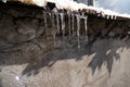 Melting icicles on a building Royalty Free Stock Photo