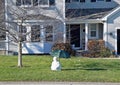 Melting snowman with umbrella Royalty Free Stock Photo