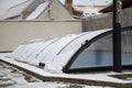 Melting snow on the pool roof going down Royalty Free Stock Photo