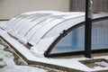 Melting snow on the pool roof going down Royalty Free Stock Photo