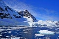 Melting snow sea white clouds ice floes icebergs. This is the landscape of Antarctica.