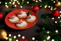 Melting snowman Christmas cookies on red plate. 3D render Royalty Free Stock Photo