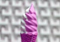 Melting White and Vivid Pink Colored Soft Serve Ice Cream Cone with Blurry Modern Concrete Wall in Background Royalty Free Stock Photo