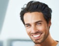 Melting womens hearts wherever he goes. Cropped portrait of a handsome young man smiling broadly. Royalty Free Stock Photo
