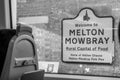 MELTON MOWBRAY, ENGLAND- 3 April 2021: Welcome to MELTON MOWBRAY sign viewed from the inside of a train