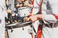 Member of a military fanfare playing a mobile bass drum on a par