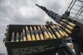 Member of the mobile air defence group checks M2 Browning machine gun atop of a pick up truck in Hostomel town, Ukraine Royalty Free Stock Photo