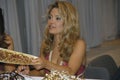 A member ofthe Washington Redskins cheerleaders signs autographs at the auto show in Washington DC Royalty Free Stock Photo