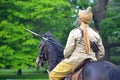 A member of the Punjab Lancers in World War One uniform riding a horse.