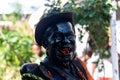 Member with a red mouth at the cultural event Nego Fugido performing for the end of slavery in Acupe