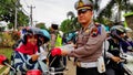 Member of the Traffic Police when inspecting motorcyclists and ticketing