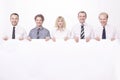 Members of the business team holding a large blank banner. Royalty Free Stock Photo