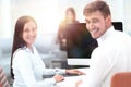 Members of the business team sitting at Desk and looking at camera . Royalty Free Stock Photo