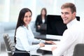 Members of the business team sitting at Desk and looking at camera . Royalty Free Stock Photo