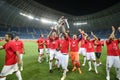 Members of CFR Cluj soccer team celebrate winning the Supercup