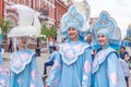 Members of dance groups in national costumes at the festive procession of graduates of schools