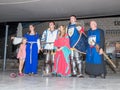 Members of the Knights of Jerusalem club dressed in the traditional armor of a knight, are fighting on swords at night in the old