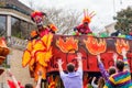 Members of Mardi Gras Krewe Throw Beads off of Parade Float