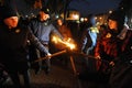 Members of the nationalist organizations hold torches as they take part in a rally marking the 70th death anniversary of Roman Shu