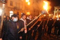 Members of the nationalist organizations hold torches as they take part in a rally marking the 70th death anniversary of Roman Shu